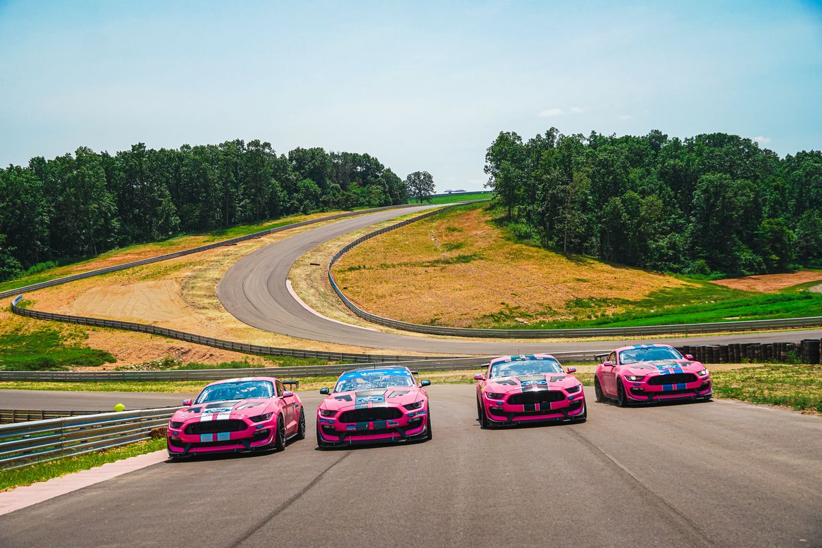 Four pink racecars in line at OIR